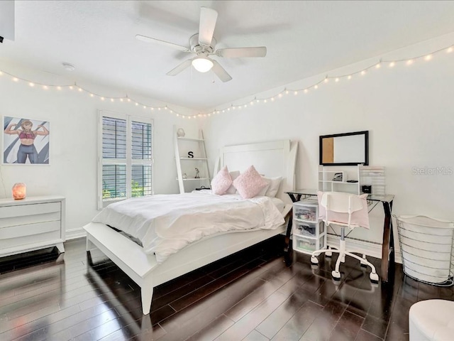 bedroom featuring dark hardwood / wood-style flooring and ceiling fan