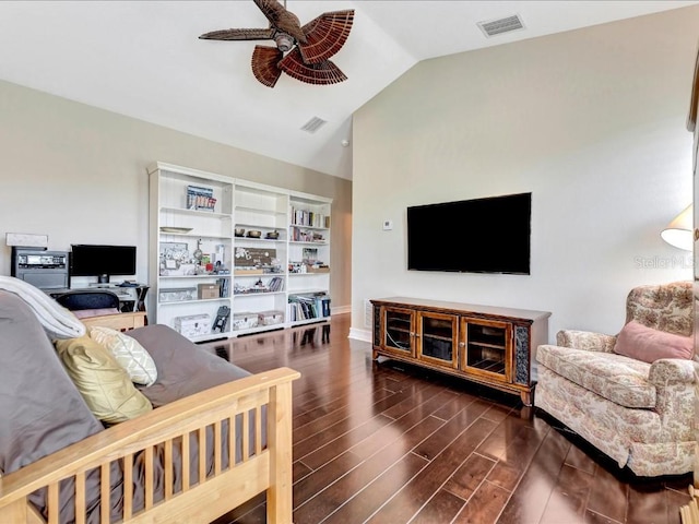 living room featuring lofted ceiling, ceiling fan, and dark hardwood / wood-style floors