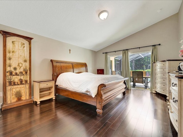 bedroom with dark hardwood / wood-style flooring, vaulted ceiling, and access to outside