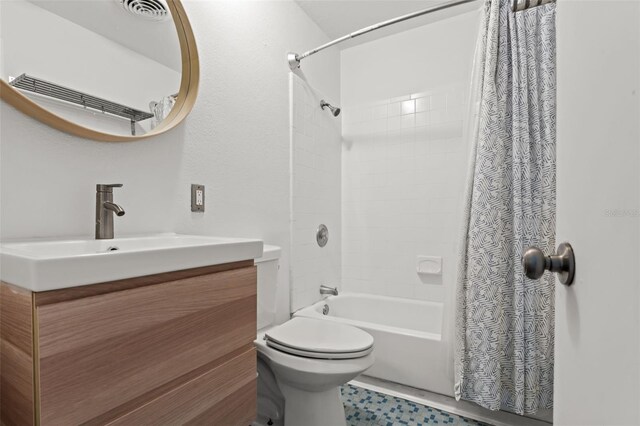 full bathroom with vanity, toilet, and shower / tub combo with curtain