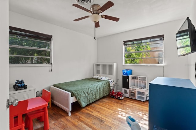 bedroom featuring ceiling fan and hardwood / wood-style flooring