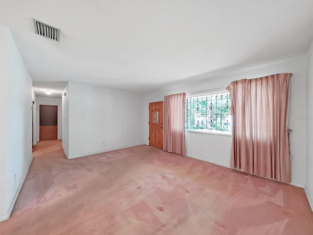 empty room with light colored carpet