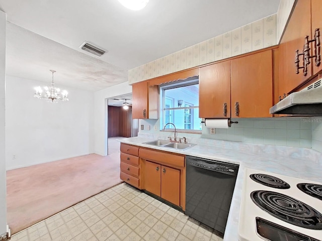 kitchen with hanging light fixtures, backsplash, black dishwasher, ceiling fan with notable chandelier, and sink