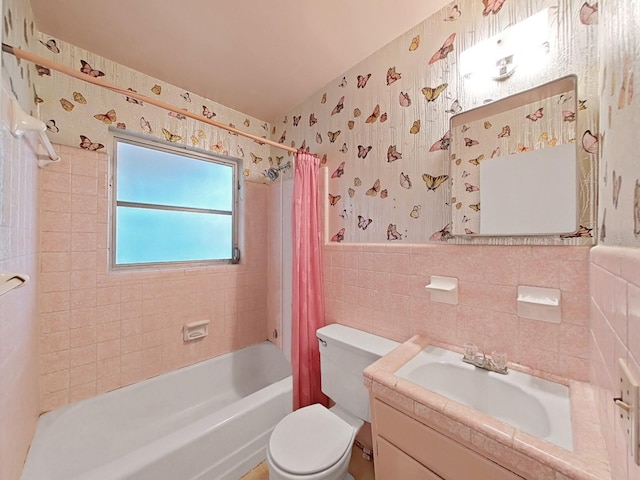 full bathroom with shower / bath combo, tile walls, backsplash, oversized vanity, and toilet