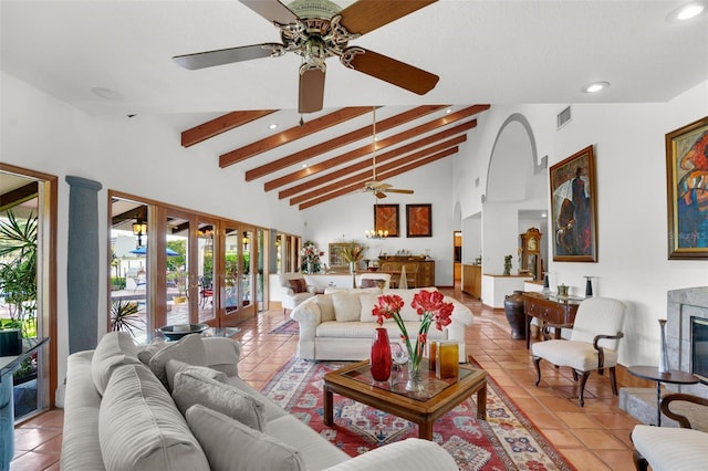 tiled living room with high vaulted ceiling, ceiling fan, french doors, and beamed ceiling