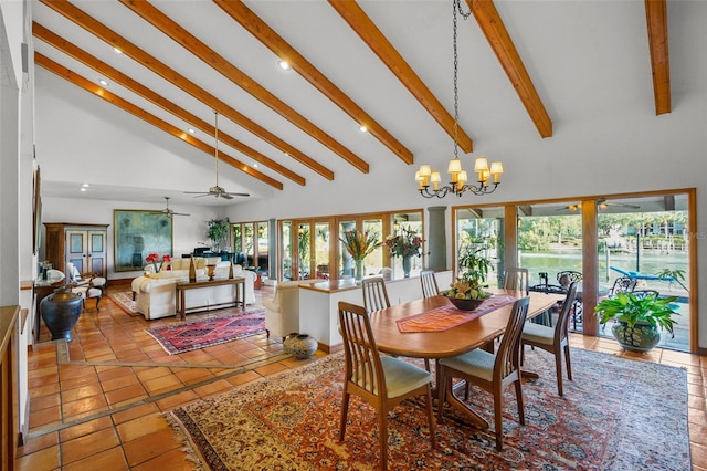 tiled dining space with beam ceiling, ceiling fan with notable chandelier, and high vaulted ceiling