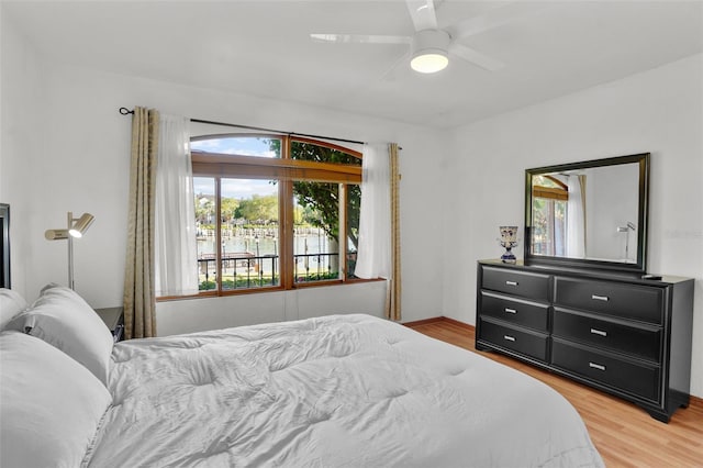 bedroom featuring ceiling fan and light hardwood / wood-style flooring