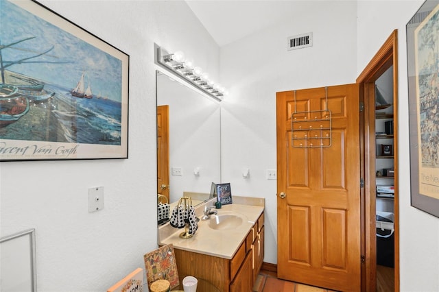 bathroom with vanity and tile patterned floors