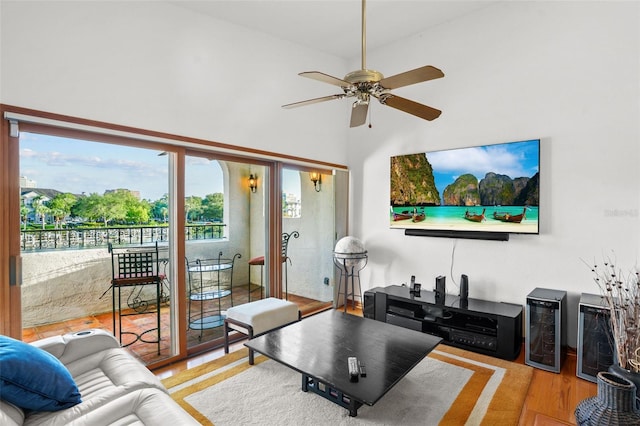 living room featuring light wood-type flooring and ceiling fan