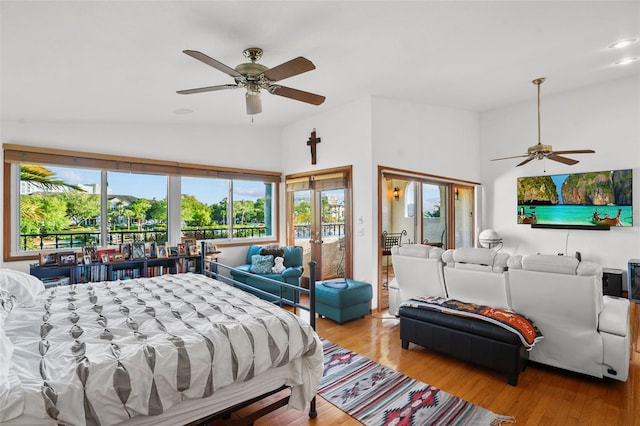 bedroom featuring ceiling fan, french doors, and light hardwood / wood-style flooring