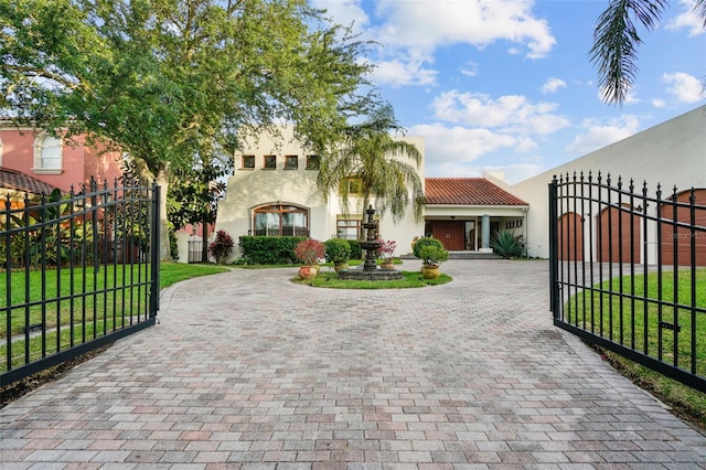 view of gate featuring a lawn