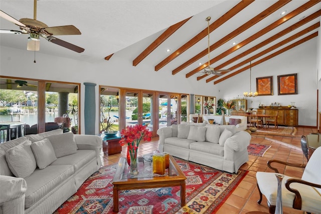 tiled living room featuring high vaulted ceiling, french doors, a wealth of natural light, and an inviting chandelier