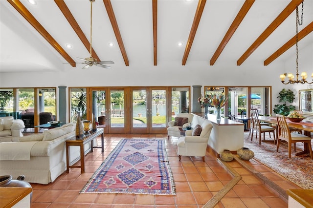 tiled living room featuring beamed ceiling, ceiling fan with notable chandelier, french doors, and high vaulted ceiling