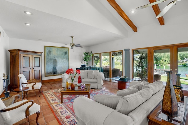 tiled living room featuring ceiling fan, high vaulted ceiling, beam ceiling, and french doors