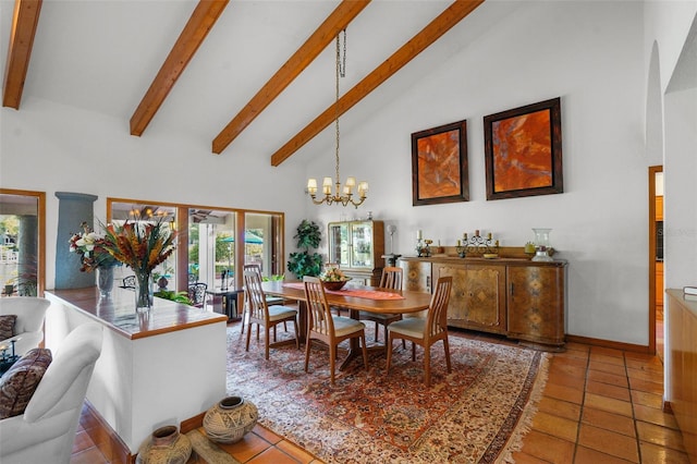 dining room with tile patterned flooring, beam ceiling, a chandelier, and high vaulted ceiling