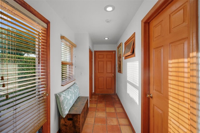 hallway featuring light tile patterned floors