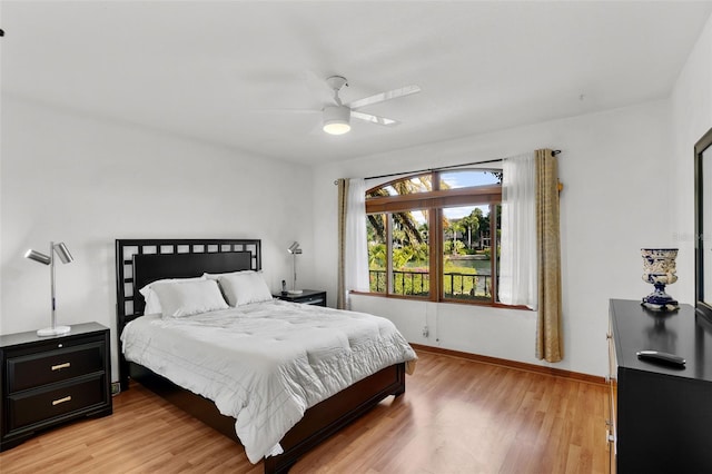 bedroom with ceiling fan and light wood-type flooring