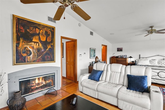 living room featuring light hardwood / wood-style floors and lofted ceiling