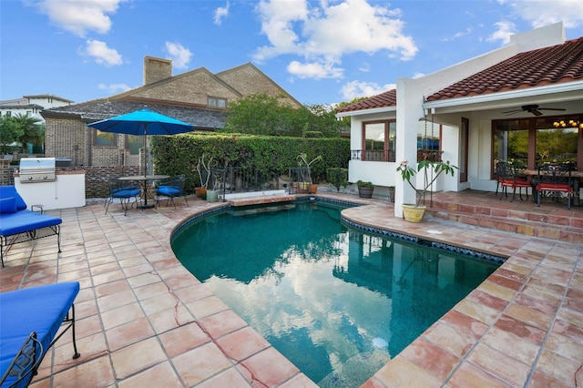 view of swimming pool with ceiling fan, area for grilling, and a patio