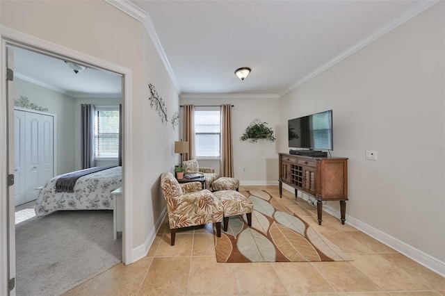 sitting room featuring light colored carpet, plenty of natural light, and ornamental molding