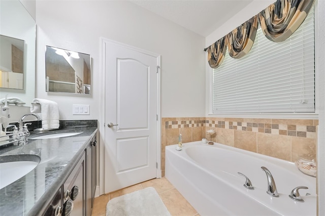 bathroom with a bathing tub, double vanity, and tile flooring