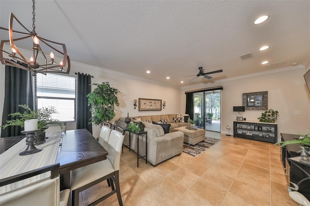 living room featuring ceiling fan with notable chandelier, crown molding, and light tile flooring