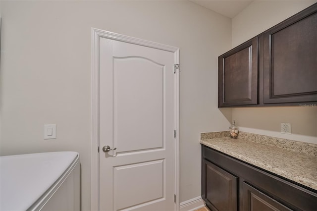 washroom featuring cabinets