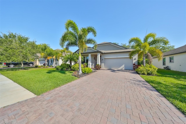 single story home with a garage and a front yard