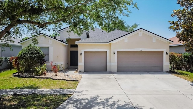 ranch-style home featuring a garage