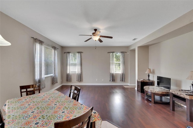 dining room featuring dark hardwood / wood-style flooring and ceiling fan