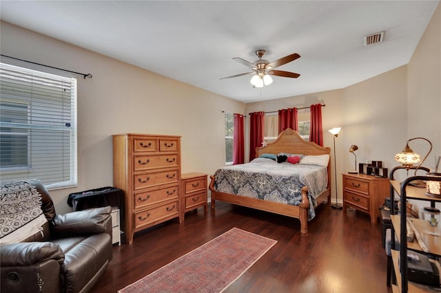 bedroom featuring ceiling fan and dark hardwood / wood-style floors