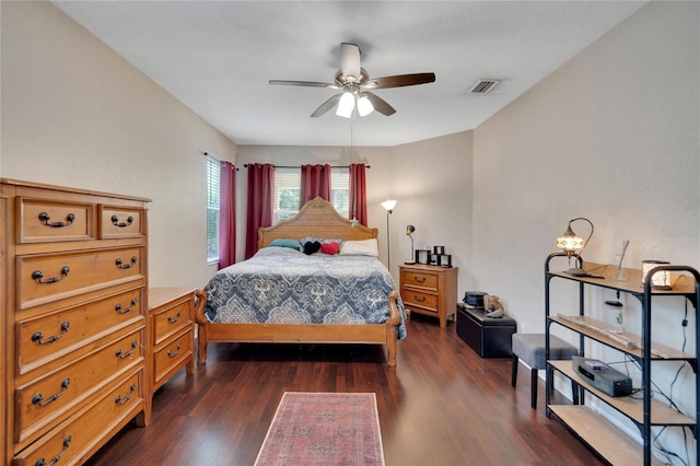 bedroom featuring ceiling fan and dark hardwood / wood-style floors