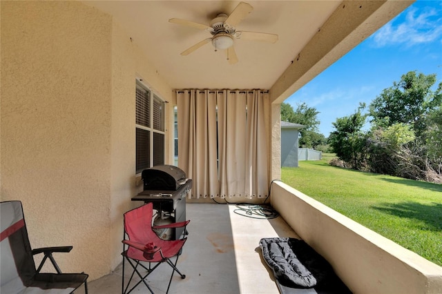 view of patio with ceiling fan and area for grilling