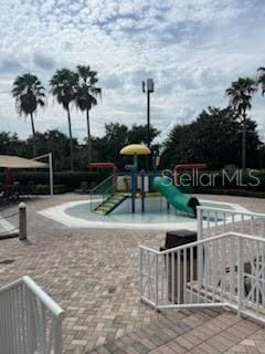 view of property's community featuring a playground