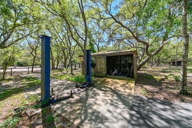 view of home's community with an outdoor structure