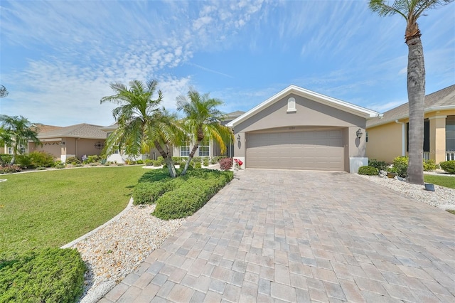 ranch-style house with a garage and a front lawn