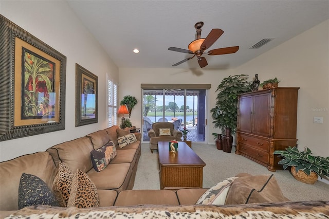 living room featuring light colored carpet and ceiling fan