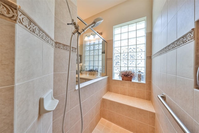 bathroom featuring a tile shower