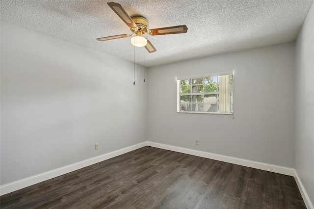 empty room with a textured ceiling, ceiling fan, and dark hardwood / wood-style floors