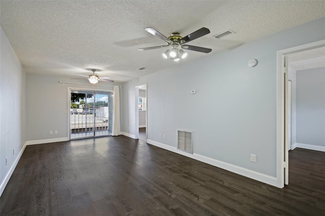 empty room featuring a textured ceiling, ceiling fan, and dark hardwood / wood-style floors