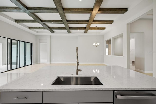 kitchen featuring gray cabinetry, coffered ceiling, a sink, open floor plan, and stainless steel dishwasher