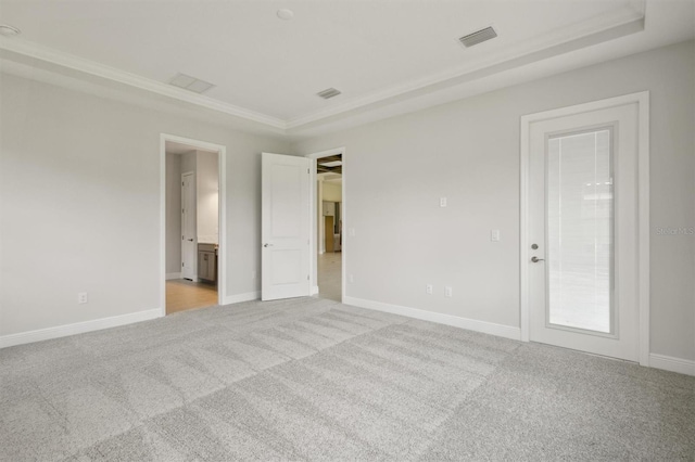 unfurnished bedroom with light colored carpet and ornamental molding