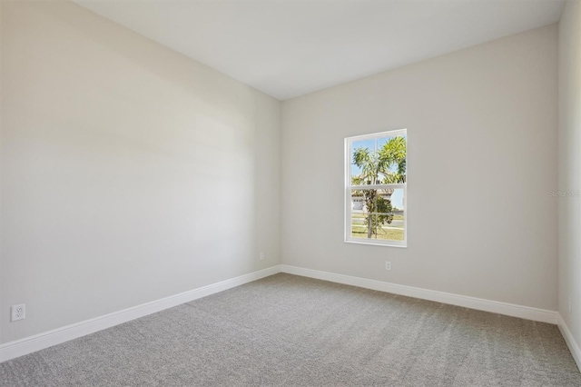 unfurnished room with carpet floors