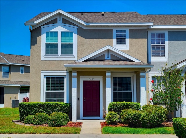 view of front of property with central AC unit