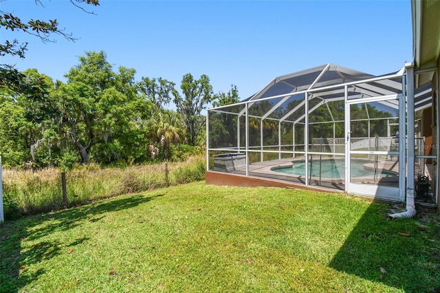 view of yard featuring glass enclosure