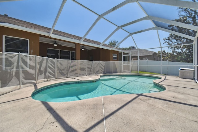 view of pool with a patio area, ceiling fan, and a lanai