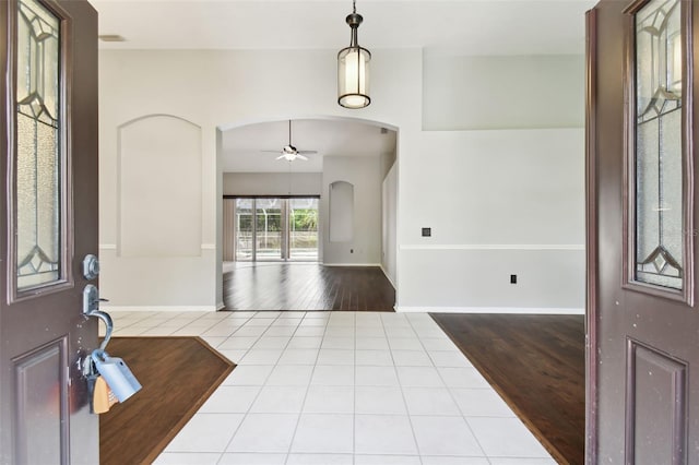 foyer featuring ceiling fan and light hardwood / wood-style floors