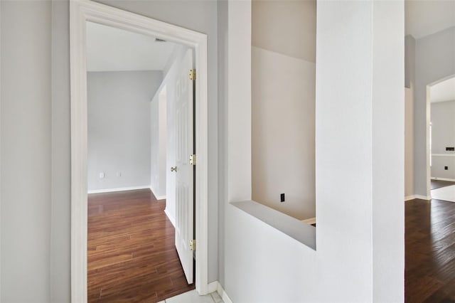 hall with dark hardwood / wood-style floors