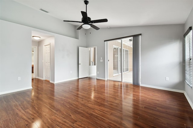 unfurnished room with lofted ceiling, ceiling fan, and dark wood-type flooring