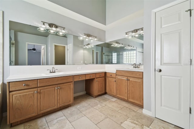 bathroom featuring tile floors, ceiling fan, and double sink vanity